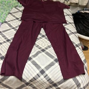 Never worn size medium made by  ascent; maroon colored scrub set.
